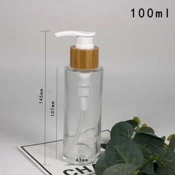 цилиндрический флакон эмульсии из прозрачного стекла объемом 100 мл, косметическая упаковка с бамбуковой крышкой
